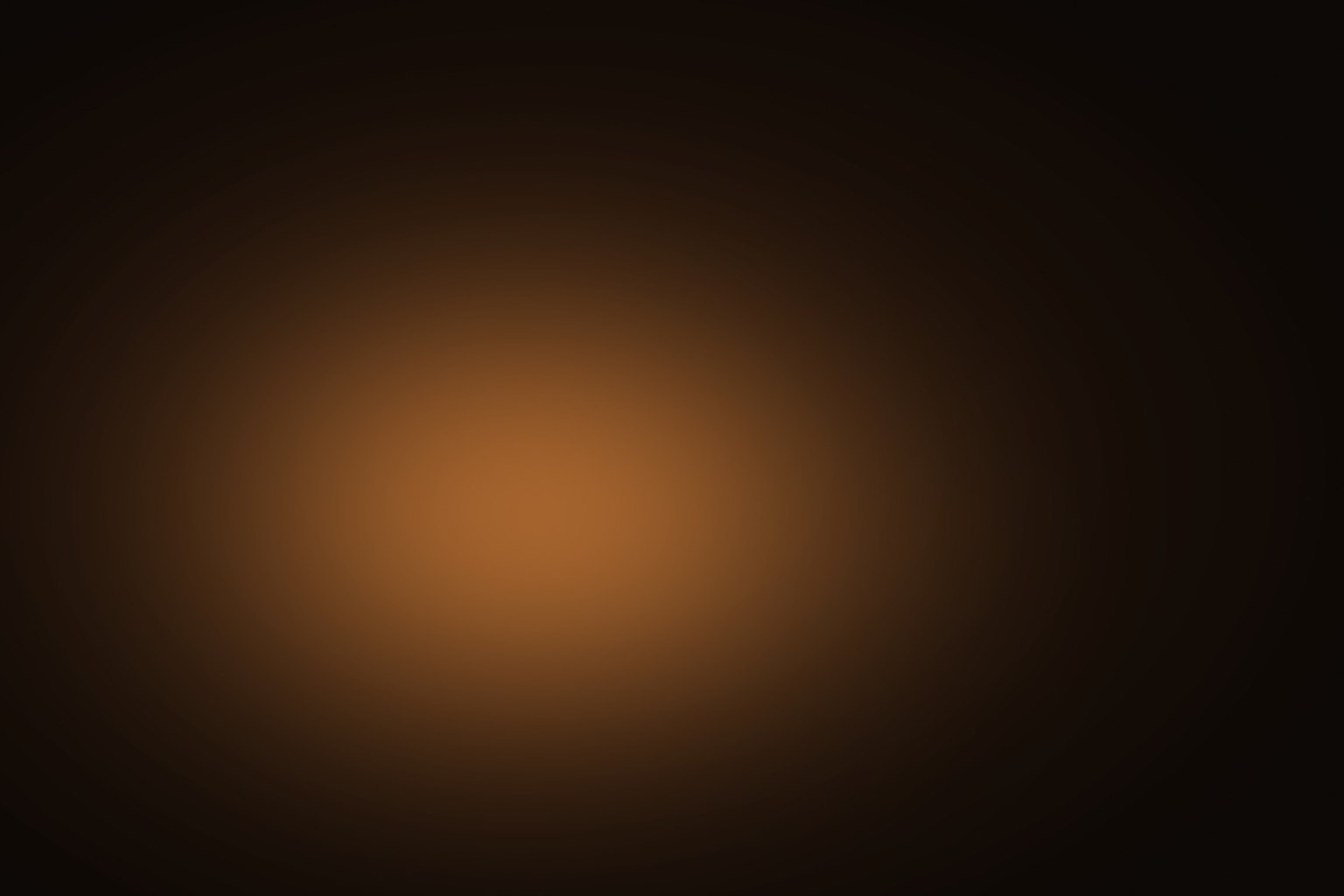 A warm amber pool of lamplight dissolving into a dark walnut field, as if a single reading lamp had been lit over a scholar's table late at night.
